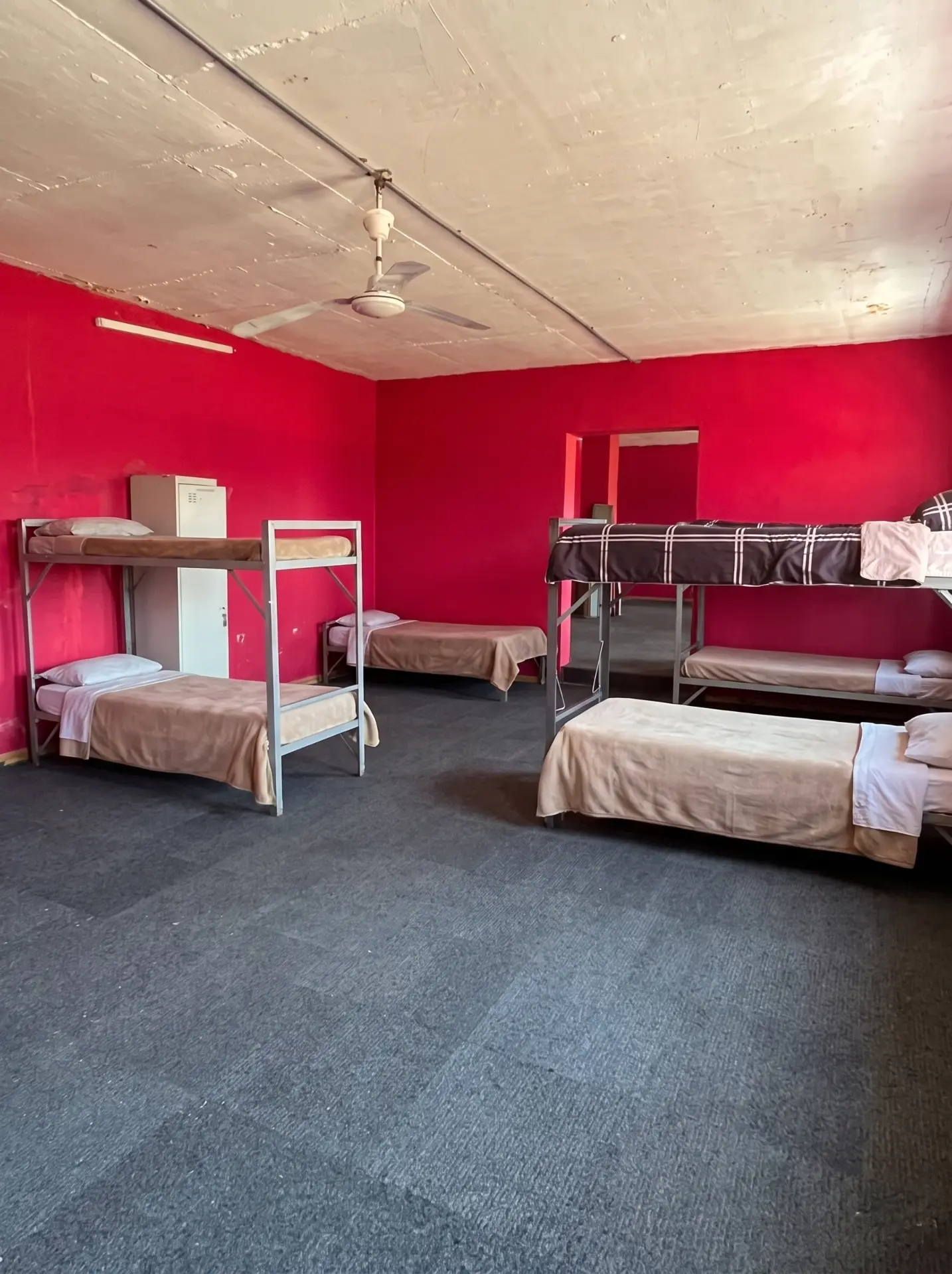 Boys' dormitory with bunk beds and lockers