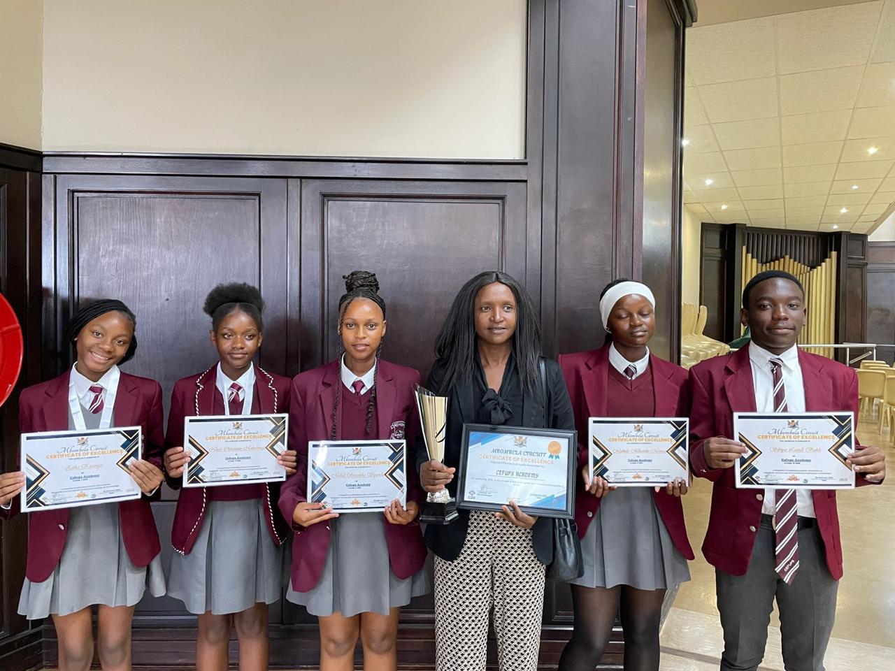 Cefups Academy top achievers — Certificates of Excellence and the circuit trophy, Mbombela Circuit 2026.