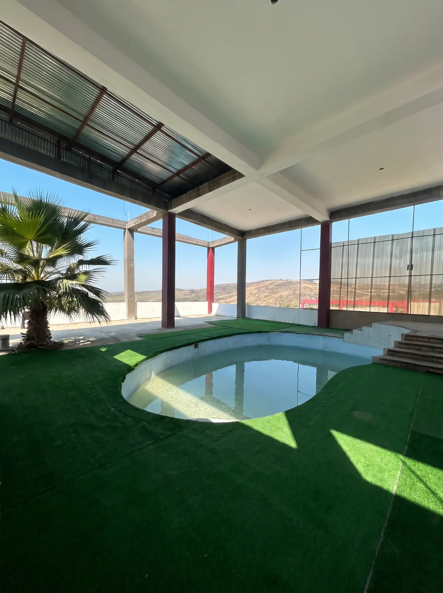 Covered poolside recreation area on campus