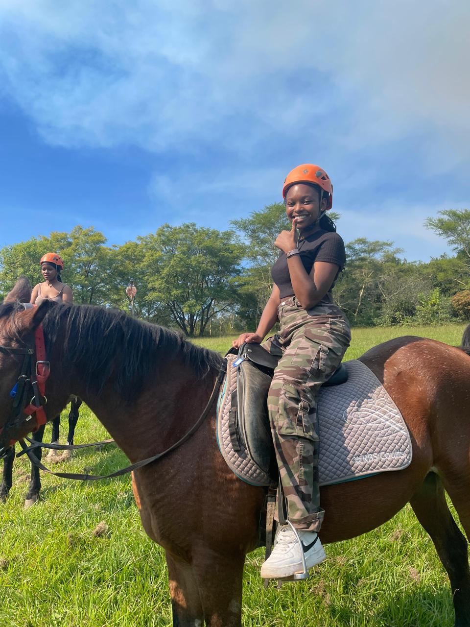 A Cefups Academy learner smiling on horseback during a riding outing